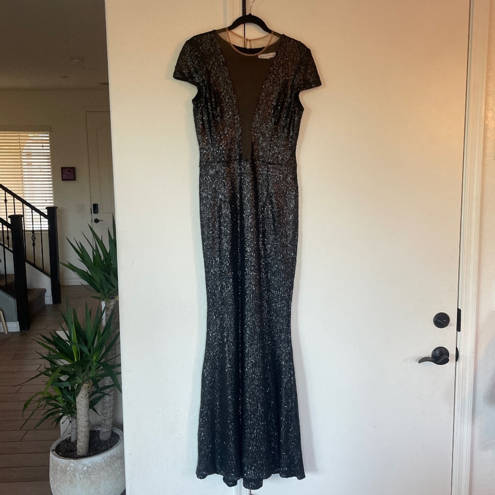 Wore once for a wedding and no longer wear this size dress.